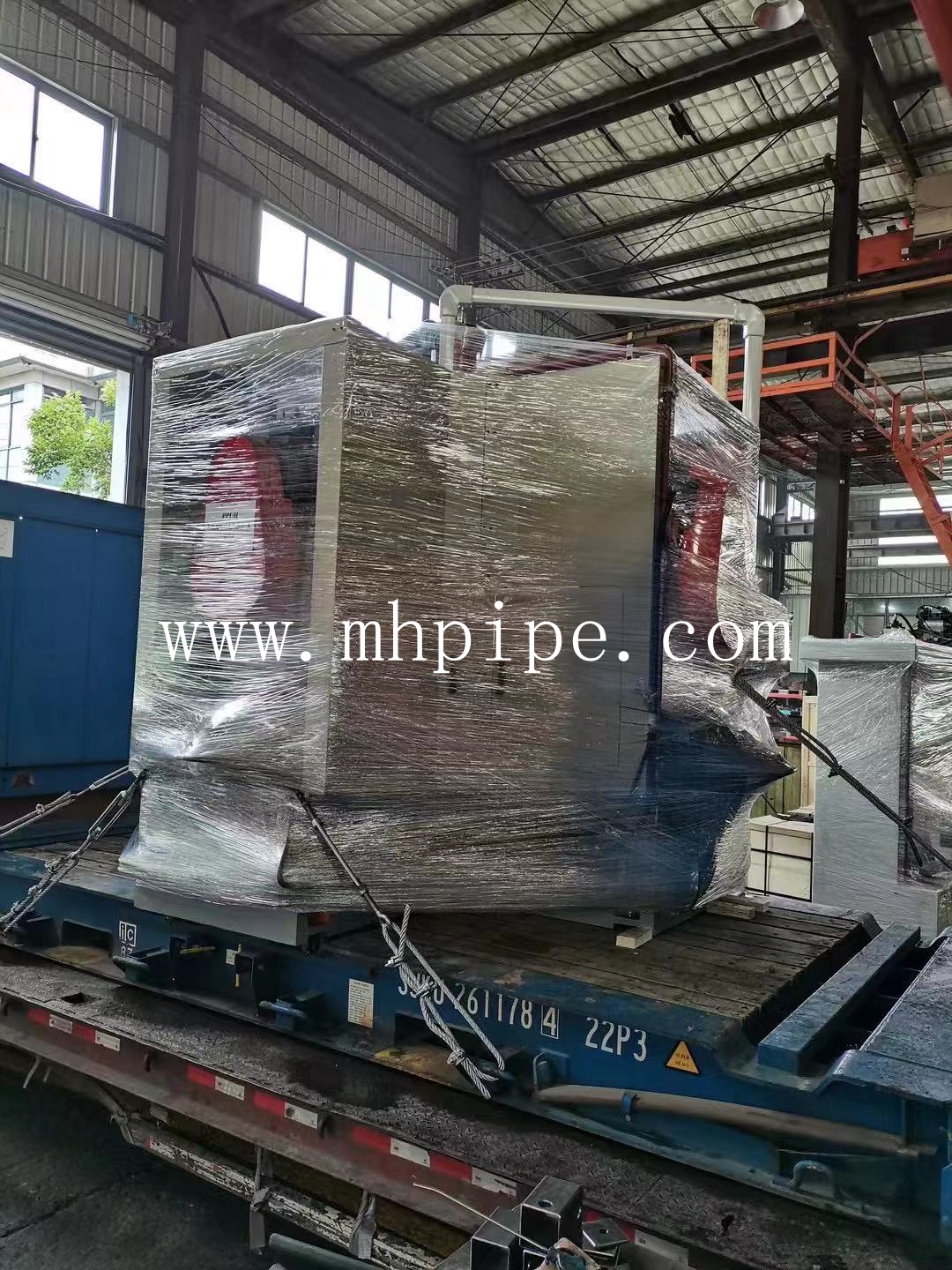Elbow cold forming machine and beveling machine on its way to Europe 